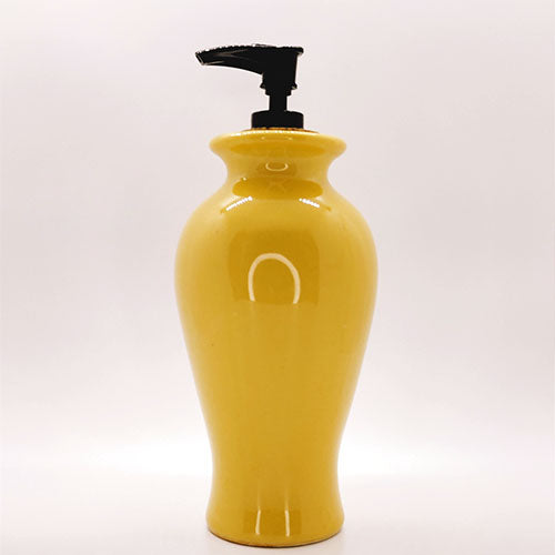 Yellow ceramic vase turned soap dispenser